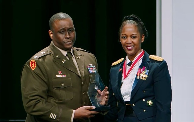 Lt. Col. Michael Pope receives an award for professional achievement at the 38th annual Becoming Everything You Are (BEYA) conference, Baltimore, Md., February 17, 2024.