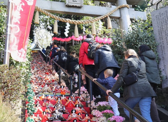 Visitors to Zama Shrine admire the rows of dolls on display for the Dolls Festival, or "Hinamatsuri," in Zama, Japan, March 1, 2024. The Army Community Service at Camp Zama hosted a walking tour to the shrine for community members to enjoy the festival. 