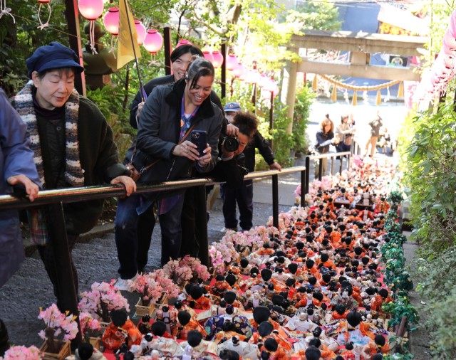 Visitors to Zama Shrine admire the rows of dolls on display for the Dolls Festival, or "Hinamatsuri," in Zama, Japan, March 1, 2024. The Army Community Service at Camp Zama hosted a walking tour to the shrine for community members to enjoy the festival. 