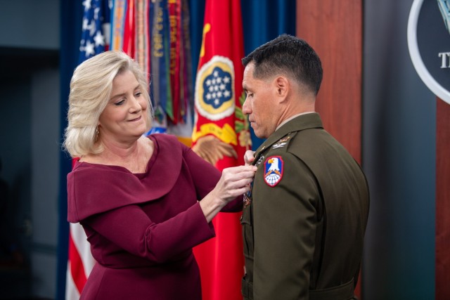 Secretary of the U.S. Army Christine E. Wormuth presents the Army Astronaut Device to Col. Frank Rubio, a NASA astronaut, during a pinning ceremony at the Pentagon Press Briefing Room, in Arlington, Va., Feb. 22, 2024. Rubio was awarded for holding the U.S. record for the most days in space for a single spaceflight. Rubio returned to Earth on Sept. 27, 2023, aboard a Russian Soyuz spacecraft, after serving 371 days aboard the International Space Station. With this award, Rubio joins Col. Anne McClain and Col. Andrew Morgan as the only active-duty Soldiers authorized to wear the device.  (U.S. Army photo by Sgt. Deonte Rowell)