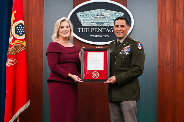 Secretary of the Army Christine Wormuth presents the Army Astronaut Device to Col. Frank Rubio during a pinning ceremony at the Pentagon Press Briefing Room, Feb. 22, 2024. 