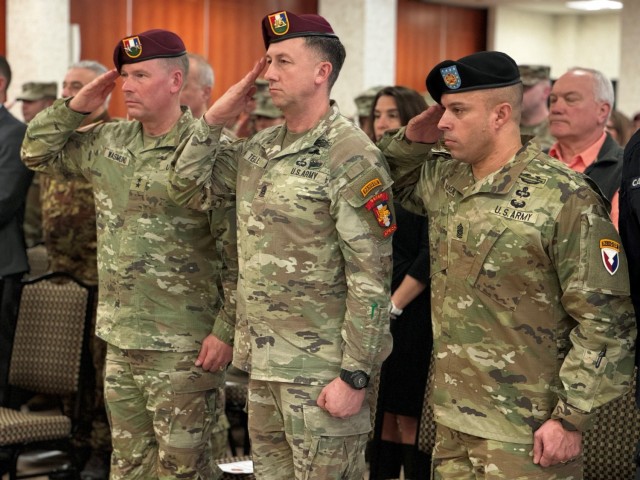 Command Sgt. Maj. Ricardo Moreno (right), Command Sgt. Maj. Reese Teakell(center), and Maj. Gen. Todd Wasmund (left) saluting during the National Anthem as part of Moreno’s assumption of responsibility ceremony.