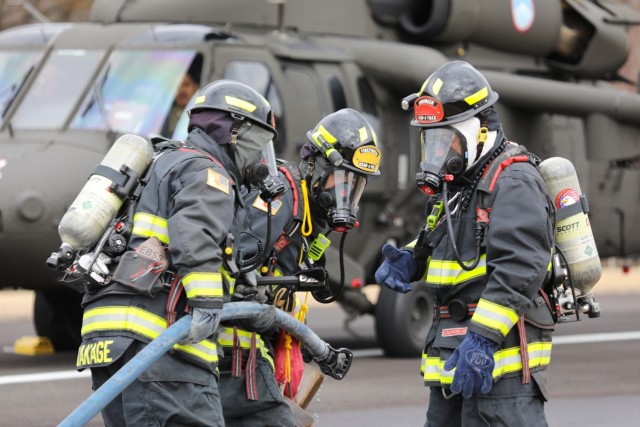U.S. Army Garrison Japan firefighters extinguish a mock fire on a UH-60 Black Hawk helicopter as part of a downed aircraft exercise at Camp Zama, Japan, March 7, 2024. Firefighters also evacuated the aircrew to a nearby safe location and used radio communication to coordinate their efforts with the air traffic control tower.