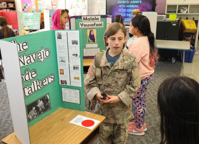 Rowan Brown, a fourth grader at Arnn Elementary School, portrays a Navajo Code Talker during a living wax museum event inside the school at Sagamihara Family Housing Area, Japan, March 21, 2024. Brown was one of several fourth graders to dress up as their favorite historical figure for the museum, the culminating event of a school project that began in the fall. 
