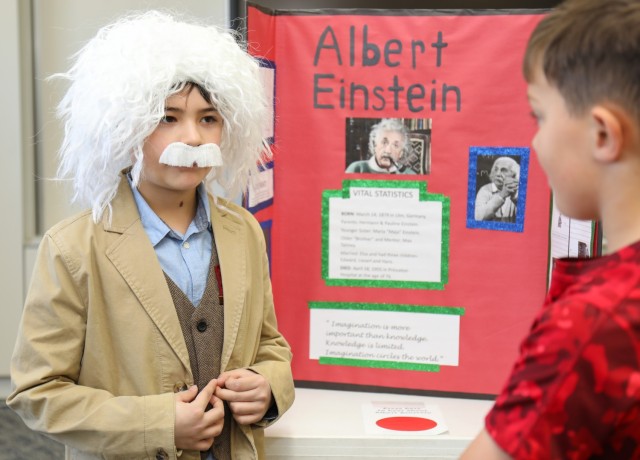 Jose Martinez, left, a fourth grader at Arnn Elementary School, portrays Albert Einstein during a living wax museum event inside the school at Sagamihara Family Housing Area, Japan, March 21, 2024. Martinez was one of several fourth graders to dress up as their favorite historical figure for the museum, the culminating event of a school project that began in the fall. 