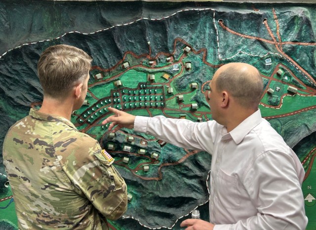Adam Negri, right, Kure installation manager, discusses munition storage operations at Kawakami Munition Depot with Col. Marcus Hunter, U.S. Army Garrison Japan commander, during the commander’s February trip to the Kure Ammunition District in Hiroshima, Japan.