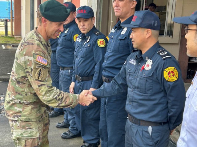 Col. Marcus Hunter, left, U.S. Army Garrison Japan commander, meets garrison firefighters during his recent two-day trip to the Kure Ammunition District in Hiroshima, Japan. Hunter took the time to meet garrison employees and discuss their successes and the challenges they face supporting the mission daily in Kure.