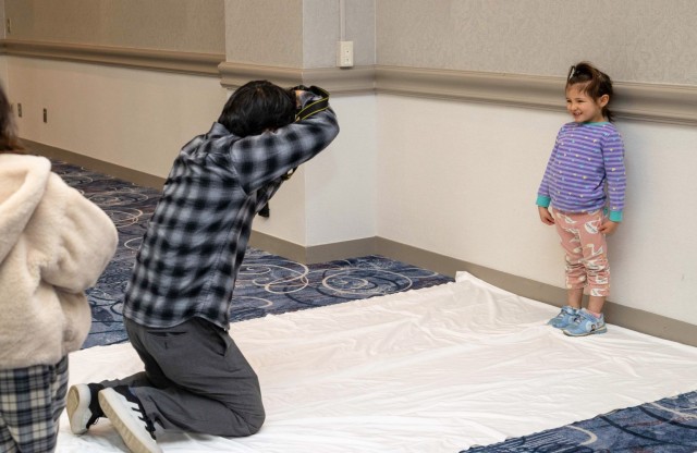 A young community member has her photo taken by a talent and model agency during a modeling fair at the Camp Zama Community Club in Japan, March 2, 2024. About 200 people attended the event, which also kicked off this year's Army Emergency Relief campaign.