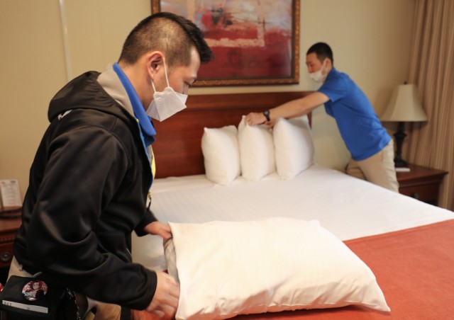 Ben Sarabia, left, and Maki Yoshifumi, both housekeepers at the Camp Zama Army Lodging in Japan, help clean a room before a guest checks in to the facility March 5, 2024. The lodging team recently won the fiscal 2023 Lodging Operation of the Year Award for medium-sized facilities.