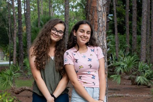 Katie, 16, and Lily, 14, Finocchiaro, who are currently stationed at the Presidio of Monterey, pose for a photo.