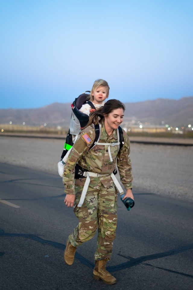Capt. Bradshaw with her daugher Averie during a ruck march.