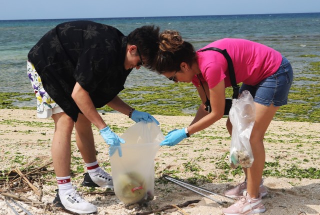 Volunteers on Okinawa work together to beautify beach on Earth Day  
