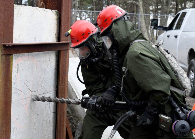 JOINT BASE MCGUIRE-DIX-LAKEHURST, N.J. – U.S. Army Soldiers from the New York National Guard’s 827th Engineer Company, 104th Military Police Battalion, drill through a concreate slab while conducting search and extraction operations during a training exercise, April 17, 2024.  Led by personnel from the 42nd Infantry Division making up the Region II Homeland Response Force, the week-long exercise brought together elements from across the New York National Guard and others to test their capability to conduct casualty assistance, decontamination, medical triage, and fatality search and recovery to save lives and mitigate human suffering.