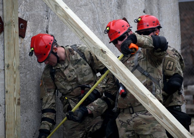 JOINT BASE MCGUIRE-DIX-LAKEHURST, N.J. – U.S. Army Soldiers from the New York National Guard’s 827th Engineer Company, 204th Engineer Battalion, construct support frames while conducting search and extraction operations during a training exercise, April 17, 2024.  Led by personnel from the 42nd Infantry Division making up the Region II Homeland Response Force, the week-long exercise brought together elements from across the New York National Guard and others to test their capability to conduct casualty assistance, decontamination, medical triage, and fatality search and recovery to save lives and mitigate human suffering.