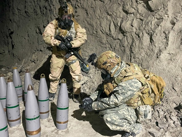 Soldiers working as technical escorts of the 9th Chemical, Biological, Radiological, Nuclear, and Explosives Company, 110th Chemical Battalion, scan simulated ammunition rounds for chemicals underground during the emergency deployment readiness exercise at Fort Knox, Ky., April 26, 2021. This underground training teaches the participants valuable skills to deal with real world situations ensuring they are ready for any situation. Deployment Readiness Exercises allow commanders from company to corps level to train their staff on the detailed planning and coordination required to move units overseas on a condensed timeline. 