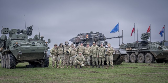 U.S. Army air defenders with Charlie Battery, 5-4 ADA, pose for a photo during Saber Strike 2024 April 22 in Poland. During the exercise, Charlie Battery conducted live fire engagements alongside Romanian Geperd air defense vehicles in support of U.S. and NATO forces.