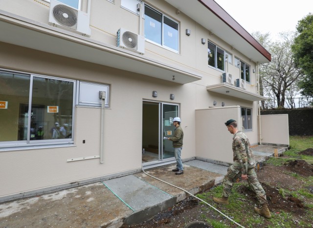 Col. Marcus Hunter, right, commander of U.S. Army Garrison Japan, inspects a renovated home at Camp Zama, Japan, April 9, 2024. Hunter and Command Sgt. Maj. David A. Rio, garrison senior enlisted leader, toured a 20-home renovation project to see firsthand the construction that may be replicated at other sites as the garrison plans to roll out several more upgrades across its inventory. 