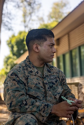 U.S. Navy Petty Officer 2nd Class Abm Asim, a hospital corpsman with Marine Rotational Force – Darwin 24.3, demonstrates how to properly prepare medical equipment to draw blood during Valkyrie emergency fresh whole blood transfusion training at Robertson Barracks, Darwin, NT, Australia, May 16, 2024. The Valkyrie program enables military units to self-supply blood through emergency donor panels by adequate training, rehearsal, and preparation, gaining the skills and knowledge to efficiently collect whole blood, and conduct blood transfusions in the event of a casualty. Asim is a native of Florida. (U.S. Marine Corps photo by Cpl. Juan Torres)