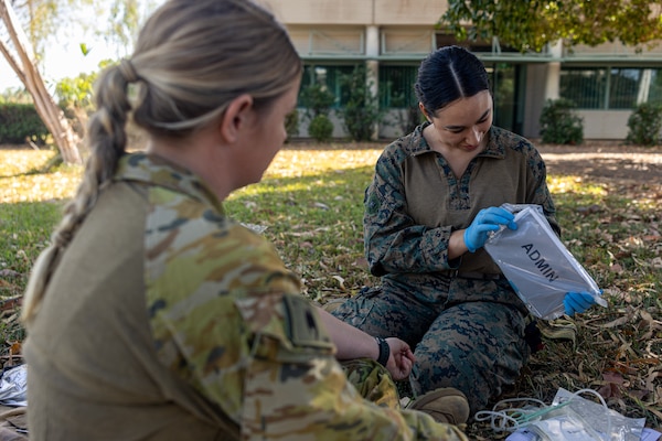 Australian Army PTE. Melissa Murray, left, a medical technician with 1st Health Battalion, 2nd Health Brigade, and U.S. Navy Petty Officer 3rd Class Ariana Buckley, a hospital corpsman with Combat Logistics Battalion 5 (Reinforced), Marine Rotational Force – Darwin 24.3, organize medical equipment during Valkyrie emergency fresh whole blood transfusion training at Robertson Barracks, Darwin, NT, Australia, May 16, 2024. The Valkyrie program enables military units to self-supply blood through emergency donor panels by adequate training, rehearsal, and preparation, gaining the skills and knowledge to efficiently collect whole blood, and conduct blood transfusions in the event of a casualty. Buckley is a native of New York. (U.S. Marine Corps photo by Cpl. Juan Torres)