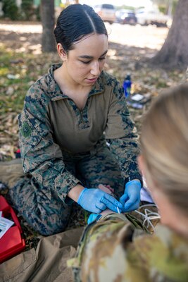 U.S. Navy Petty Officer 3rd Class Ariana Buckley, left, a hospital corpsman with Combat Logistics Battalion 5 (Reinforced), Marine Rotational Force – Darwin 24.3, simulates drawing blood during Valkyrie emergency fresh whole blood transfusion training at Robertson Barracks, Darwin, NT, Australia, May 16, 2024. The Valkyrie program enables military units to self-supply blood through emergency donor panels by adequate training, rehearsal, and preparation, gaining the skills and knowledge to efficiently collect whole blood, and conduct blood transfusions in the event of a casualty. Buckley is a native of New York. (U.S. Marine Corps photo by Cpl. Juan Torres)