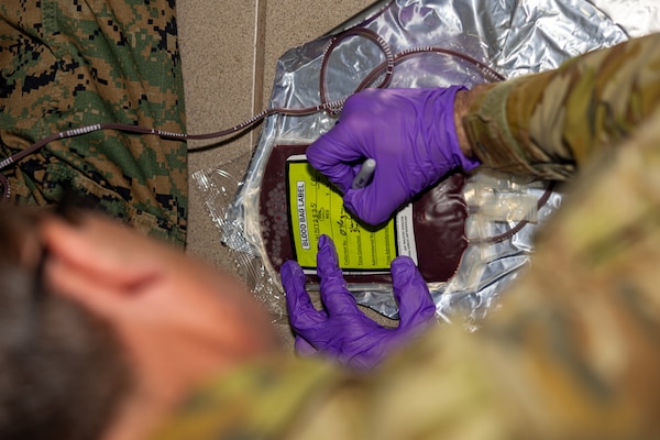 Australian Army Sgt. Sean O’Regan, a medical technician with 1st Health Battalion, 2nd Health Brigade, draws blood during Valkyrie emergency fresh whole blood transfusion training at Robertson Barracks, Darwin, NT, Australia, May 17, 2024. The Valkyrie program enables military units to self-supply blood through emergency donor panels by adequate training, rehearsal, and preparation, gaining the skills and knowledge to efficiently collect whole blood, and conduct blood transfusions in the event of a casualty. (U.S. Marine Corps photo by Cpl. Juan Torres)