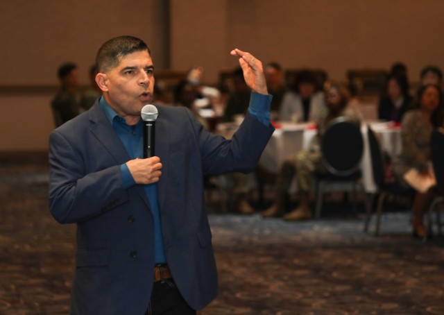 John Arroyo, a former Special Forces Soldier who was wounded in a mass shooting, shares his story with more than 100 community members at a National Day of Prayer breakfast May 9, 2024, inside the Camp Zama Community Club in Japan.