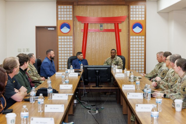 John Arroyo, center left, a former Special Forces Soldier who was wounded in a mass shooting, speaks to enablers and caregivers during a resiliency workshop inside the U.S. Army Japan headquarters building at Camp Zama, May 9, 2024.