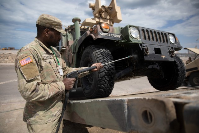 U.S. Army Spc. Kristopher Hatton with 1st Battalion, 175th Infantry Regiment, Maryland National Guard, pressure-washes a Humvee as part of wash rack operations in Gabes, Tunisia, May 9, 2024. African Lion 2024 marks the 20th anniversary of U.S. Africa Command’s premiere joint exercise led by U.S. Army Southern European Task Force, Africa (SETAF-AF), running from April 19 to May 31 across Ghana, Morocco, Senegal and Tunisia, with over 8,100 participants from 27 nations and NATO contingents. (U.S. Army photo by Spc. Trevor Seiler)