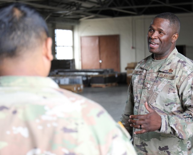 Air Force Chief Master Sgt. Leon Calloway, right, senior enlisted adviser for U.S. Forces Japan, speaks with Soldiers assigned to the 5th Transportation Company during a visit to Yokohama North Dock, Japan, May 14, 2024. Calloway conducted a tour of the small installation as part of his ongoing site visits to better understand joint missions in the country.