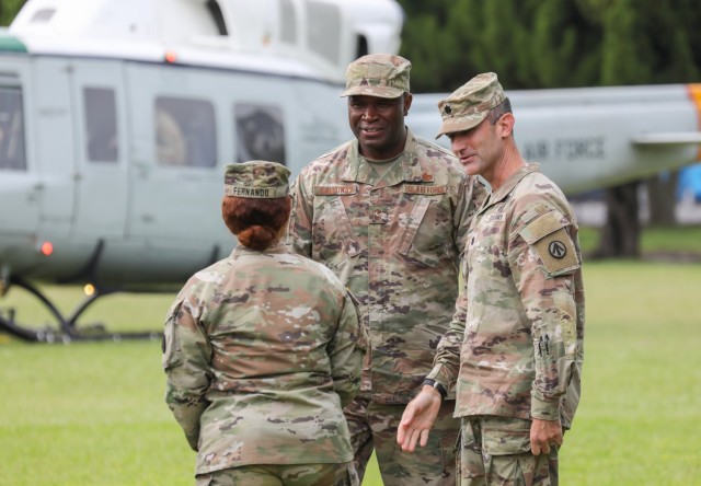 Air Force Chief Master Sgt. Leon Calloway, center, senior enlisted adviser for U.S. Forces Japan, meets with 836th Transportation Battalion leadership before conducting a tour of Yokohama North Dock, Japan, May 14, 2024. Calloway also recently visited Camp Zama and Sagami General Depot as part of his ongoing site visits to better understand joint missions in the country.