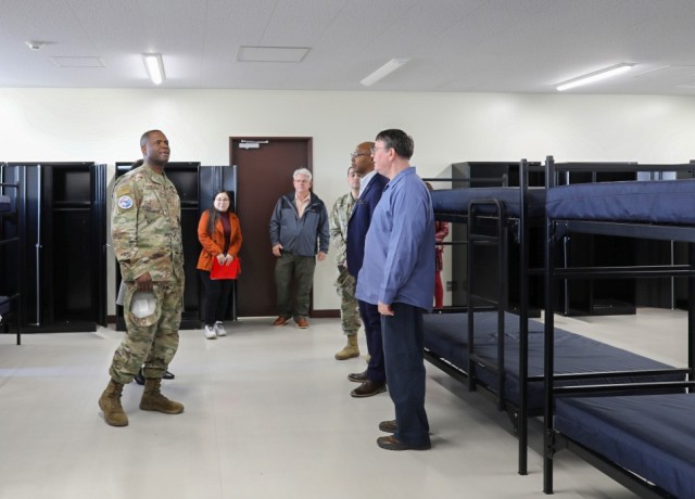Air Force Chief Master Sgt. Leon Calloway, left, senior enlisted adviser for U.S. Forces Japan, visits a barracks room while touring Camp Zama and Sagami General Depot in Japan on March 14, 2024. Calloway also recently toured Yokohama North Dock as part of his ongoing site visits to better understand joint missions in the country.