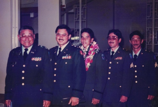 Hara and his brothers pose for a photo with their father following Hara's graduation from officer candidate school July 26, 1987. 
