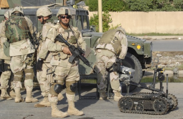 Kenneth S. Hara on patrol with an improvised explosive device robot during a deployment to Baghdad, Iraq Oct. 16, 2005. 