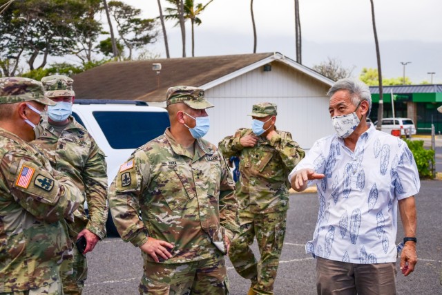 Maj. Gen. Kenneth Hara, Hawaii National Guard (HING) Adjutant General (TAG) and Dr. Lorrin W. Pang, Maui District Health Officer discuss platforms the 230th Engineer Company built for those affected by the Coronavirus during an operational circulation visit, Kahului, Hawaii, June 9, 2020.  Hara and Command Sgt. Maj. Dana Wingad, HING Senior Enlisted Leader (SEL) also spoke with Mayor Michael Victorino and Police Chief Tivoli Faaumu while visiting troops during the COVID-19 pandemic.