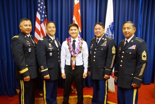 Hara, his son Justin and his three brothers pose for a photo after Justin's enlistment ceremony July 17, 2014. Justin followed in his father's footsteps of enlisting and then commissioning as an infantry officer. 