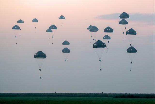 Belgian and French Soldiers parachute onto Chièvres Air Base during the Storm Tide 24 multinational exercise