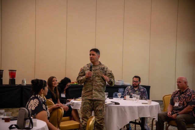 Col. RJ Garcia addressing community members and military personnel during a meeting at Schofield Barracks, where discussions on local housing, environmental issues, and the construction of a new hangar at Wheeler Army Airfield were held to foster collaboration and solutions for the northern Oʻahu community.