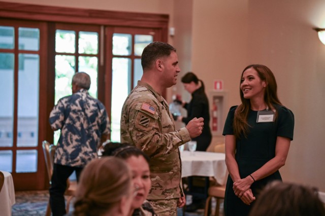 Col. RJ Garcia addressing community members and military personnel during a meeting at Schofield Barracks, where discussions on local housing, environmental issues, and the construction of a new hangar at Wheeler Army Airfield were held to foster collaboration and solutions for the northern Oʻahu community.