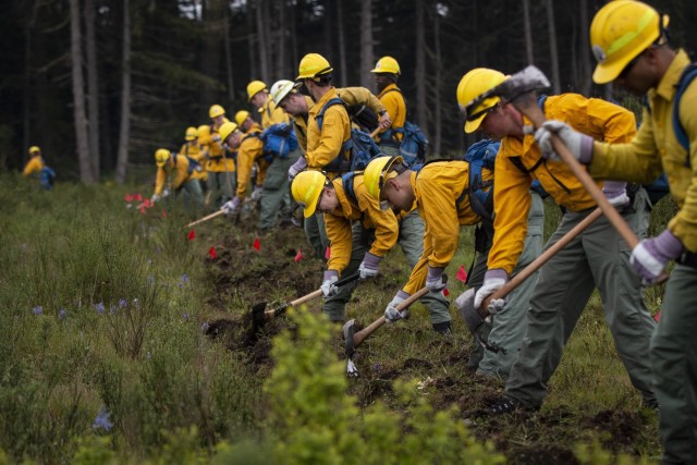 Washington National Guard service members receive training in preparation for the upcoming wildfire season during the Washington State Department of Natural Resources Interagency Wildland Fire Training Academy near Roy, Wash., May 15, 2022. The training included familiarization with hand tools, line construction and tactics, and fire shelter deployment and entrapment avoidance. 
