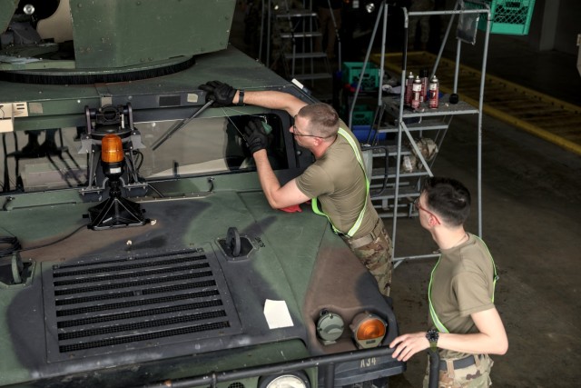 During the past week more than 5,000 Soldiers have arrived at the Joint Readiness Training Center (JRTC) on Fort Johnson, Louisiana to take part in a month-long training exercise led by the 32nd Infantry Brigade Combat Team. As they arrive the Soldiers in-process, gather gear, help offload vehicles from trains and semis, perform maintenance checks, and install MILES (multiple integrated laser engagement system) on everything from personal weapons to all varieties of vehicles, all while acclimating to the Louisiana heat and humidity.