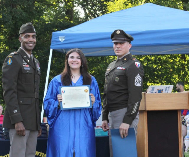 Lt. Col. Craig A. Bonham II, Picatinny Arsenal Garrison Commander (left), and Command Sgt. Maj. David M. Franks (right) with Gabrielle Landi, daughter of Picatinny Arsenal employee Donald Landi.