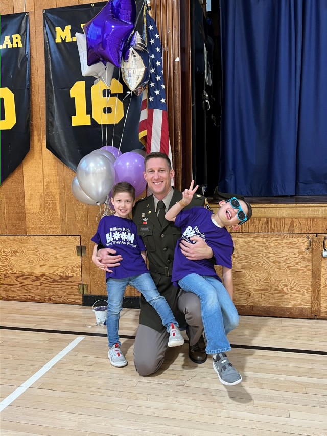 Maj. Eric Forsgren, Assistant Product Manager, Program Executive Office Soldier, and his two boys during Month of the Military Child