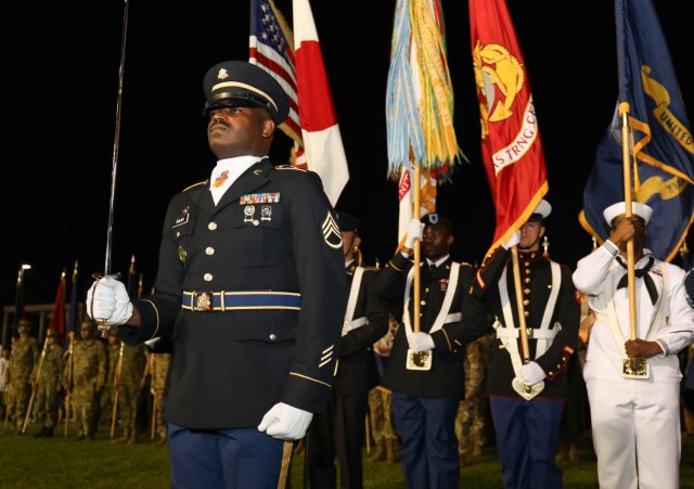 U.S. military members and Japanese counterparts participate in a “Salute to the Nation” ceremony during the Independence Day celebration at Camp Zama, Japan, June 29, 2024.