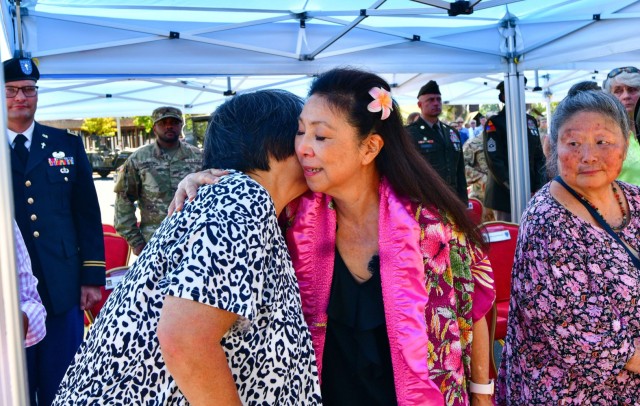 Yoko Sakato and Valerie Matsunaga, both family members of the 442nd Regimental Combat Team, a segregated U.S. Army unit whose troops were of Japanese descent – known as Nisei – embrace at a July 11 commemoration event at Camp Darby, near Pisa,...