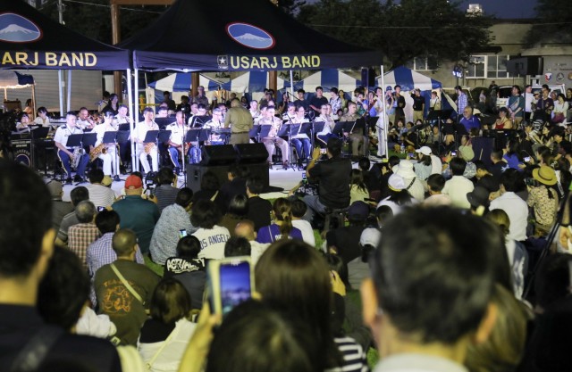 A large audience listens to the U.S. Army Japan Band as it performs in its final open-post event during the Independence Day celebration at Camp Zama, Japan, June 29, 2024.