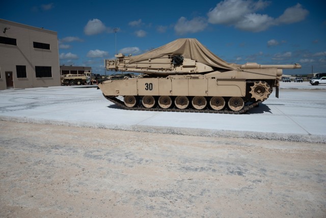 An Abrams M1A2 SEPv3 sits atop a recently finished roller-compacted concrete slab June 23, 2024, at Fort Cavazos, Texas. RCC pavement can often be opened for heavy traffic 24-48 hours after placement, an advantage for use in many applications.