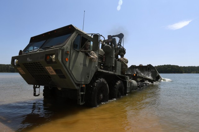 Spc. Michael Igwe, a bridge crewmember with the 125th Multi-role Bridge Company, South Carolina Army National Guard, launches an Improved Ribbon Bridge section onto the Savannah River during a training mission at Clarks Hill Training Site, S.C.,...