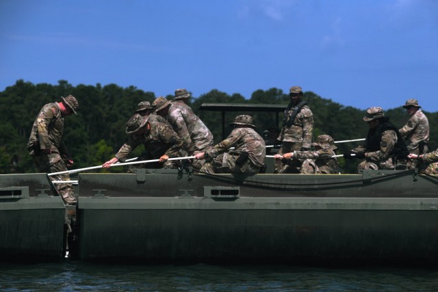 Soldiers with the 125th Multi-role Bridge Company, South Carolina Army National Guard, connect two Improved Ribbon Bridge sections during a training mission at Clarks Hill Training Site, S.C., July 17, 2024. During the training mission unit...