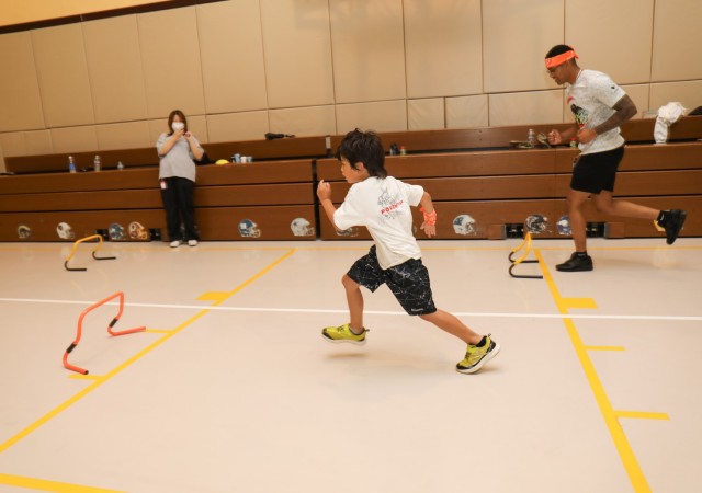 Participants race in the hurdles competition during a mini-Olympics event at the Youth Center at Camp Zama, Japan, July 24, 2024. The event had six sporting activities and a medal ceremony inside the center’s gym as part of an effort to build...