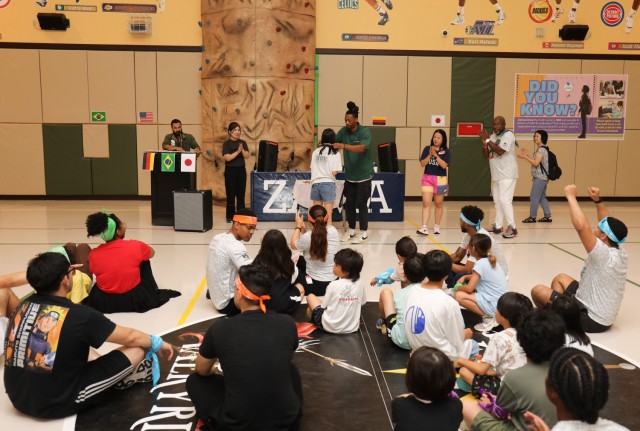 Camp Zama volunteers and residents of the Sagamihara Minami Children’s Home participate in a medal ceremony to conclude a mini-Olympics event at the Youth Center at Camp Zama, Japan, July 24, 2024. The event had six sporting activities inside...